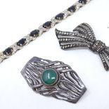 A sterling silver sapphire line bracelet, length 18cm, marcasite brooch, and green stone brooch (3)