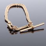 A 9ct rose gold graduated curb link Albert chain, with one dog clip and T-bar, overall length
