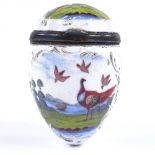 An 18th century enamel egg-shaped box with hand painted exotic bird designs, height 7cm