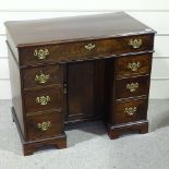 A George III mahogany knee-hole desk with alcove cupboard, width 3'1", height 2'8"
