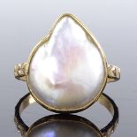 A silver-gilt baroque pearl ring, setting height 18.3mm, size P, 3.4g