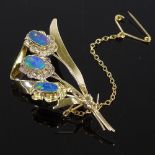 A 10ct gold black opal floral spray brooch, brooch length 53.8mm, 5.4g