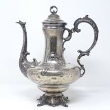 A French Art Nouveau silver teapot, with relief embossed foliate decoration, and ivory insulators,