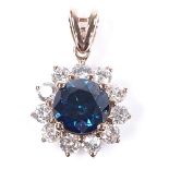 A 14ct rose gold fancy dark blue and colourless diamond cluster pendant, central stone approx 1.1ct,