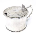 A George IV Scottish silver mustard pot, of plain cylindrical form with scroll handle and hinged