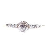 An 18ct gold 0.4ct solitaire diamond ring, with diamond set shoulders, size Q, 1.8g