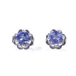 A pair of 14ct white gold solitaire aquamarine earrings, with stud fittings, earring diameter 4.8mm,