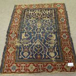 An 18th/19th century Turkish Anatolian blue ground wool rug, with red floral border, 152cm x 117cm