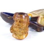 A Victorian Meerschaum pipe in the form of a bearded man, original case