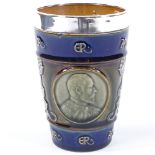 An Edward VII and Queen Alexandra Doulton Lambeth commemorative beaker with hallmarked silver rim,