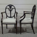 A pair of late 19th century mahogany Sheraton style elbow chairs, with carved and pierced backs, and