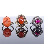 A 14ct gold carnelian dress ring, size M, a 9ct carved coral panel ring, size M, and a silver