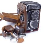 A Yashica LM camera, serial no. 124770, original leather case with additional lenses