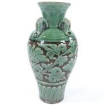 A Chinese green glaze porcelain vase, with neck ring handles and floral decoration, height 26cm