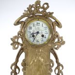A French Art Nouveau gilded spelter-cased mantel clock, ornate stylised case with relief moulded