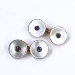 A pair of unmarked gold sapphire and mother-of-pearl circular cufflinks, panel diameter 13.5mm, 6.1g
