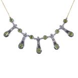 A 9ct gold and silver cabochon peridot and diamond stylised collar necklace, necklace length 45cm,