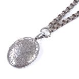 A Victorian silver locket pendant necklace, with engraved floral decoration, by Michael Joseph