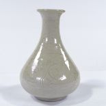 A Chinese white glazed porcelain narrow-necked vase, with incised decoration and impressed seal