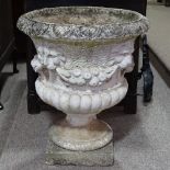 A weathered painted concrete garden urn, diameter 23", height 27.5"