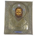 A Russian relief moulded brass-framed icon, with inset painted panel and small enamel mounts, 29cm x