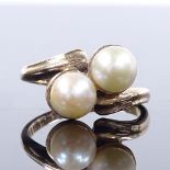 A 9ct gold double-pearl crossover ring, setting height 12mm, size M, 3.9g