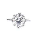 A 1920s platinum 4.24ct old-cut solitaire diamond ring, with openwork heart-shaped bridge, size O,