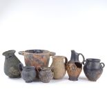 A collection of Etruscan antiquities, including a verdigris bronze vase, height 21cm, a 2-handled