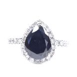 A 14ct white gold black and colourless diamond cluster ring, pear-cut black diamond approx 2.09ct,