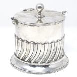 An Edwardian Scottish silver cylindrical biscuit barrel, of half fluted form, with swing handle