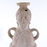 An Ancient Etruscan terracotta jar, the neck modelled as a Classical head, with traces of original