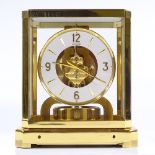 A Jaeger LeCoultre Atmos clock, gilt-brass case with glass panels, recently serviced, with