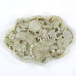 A Chinese relief carved nephrite dragon and pearl design plaque, width 9cm