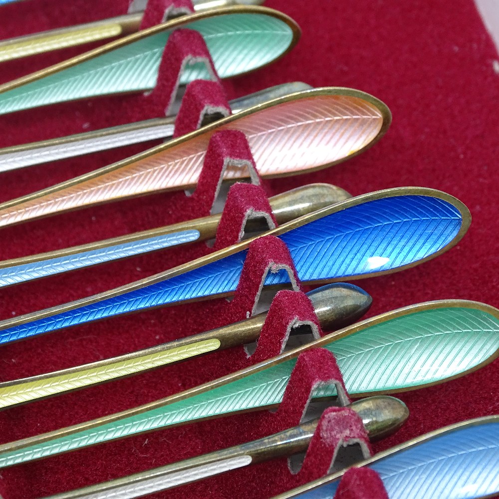 An unusual set of 12 Danish sterling silver-gilt and harlequin enamel cocaine? spoons, with leaf - Image 2 of 3