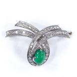 An Art Deco style 18ct white gold emerald and diamond ribbon brooch, cabochon emerald approx 2.