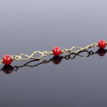 An 18ct gold red bead bracelet, bracelet length 17.5cm, 4.6g