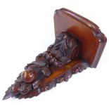 A Victorian mahogany wall bracket with carved 3-dimensional fruit and acanthus decoration, height