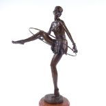 A reproduction bronze dancing girl on 2-colour marble base, overall height 48cm