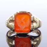 A 9ct gold carnelian intaglio seal signet ring, with engraved shoulders and bird emblem, maker's