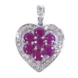 A 9ct white gold ruby and diamond cluster heart pendant, pendant height excluding bale 17mm, 2.5g