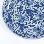 A Chinese blue and white porcelain dish, hand painted bird decoration, 6 character underglaze