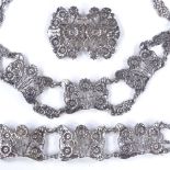 An Edwardian silver demi-parure, by William Comyns, comprising necklace, bracelet and brooch