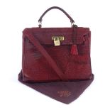 A Vintage Mulberry belted Bayswater oxblood handbag, crocodile effect with padlock, 2 keys,