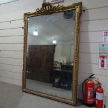A large 19th century carved giltwood and gesso-framed pier glass mirror, with laurel pediment,