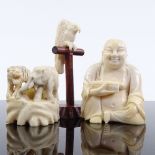 A Chinese carved ivory seated Buddha, circa 1900, height 6cm, a carved ivory okimono depicting