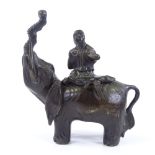 A Chinese patinated bronze incense burner, in the form of a figure seated on an elephant, height
