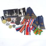 A collection of German badges, 2 postcards, Second War Period RAF epaulettes and medal ribbons