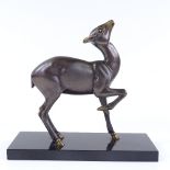 An Art Deco patinated bronze sculpture of a fawn on black marble base, unsigned, base length 28cm,