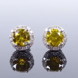 A pair of 14ct white gold 1.88ct fancy greyish yellow cluster earrings, with stud fittings, each