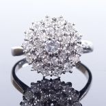 An 18ct white gold circular diamond cluster ring, central stone approx 0.15ct, setting height